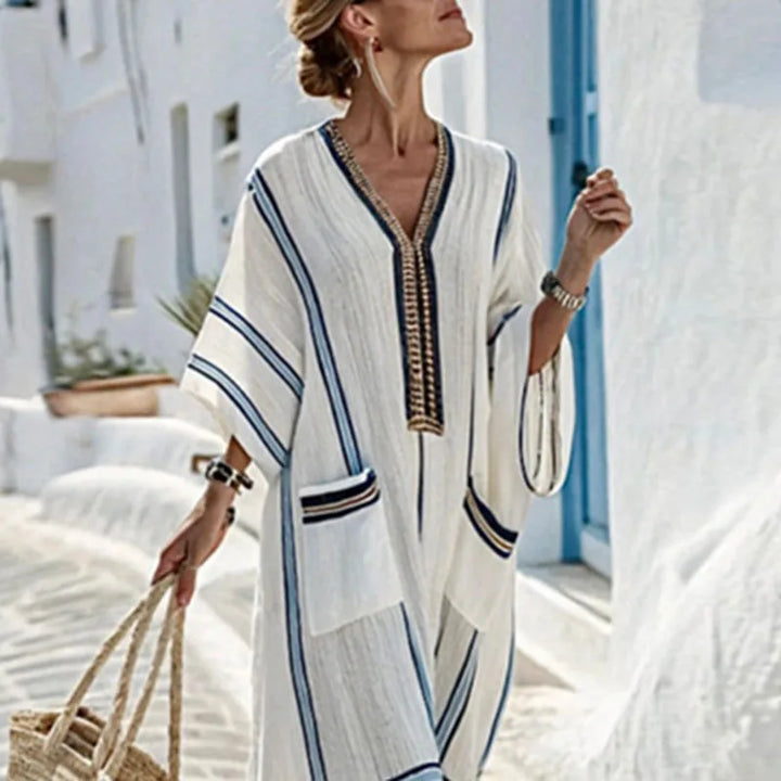 Boho summer flowy maxi dress for women, featuring a relaxed kimono style, V-neck, and practical side pockets.