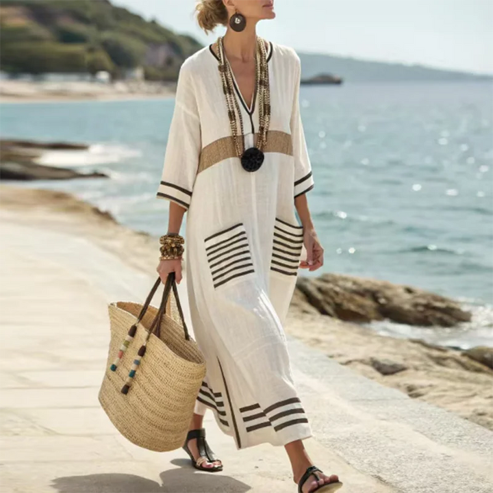 Comfortable women's flowy kimono beach dress. Stylish V-neck design, full length, and functional pockets for travel.