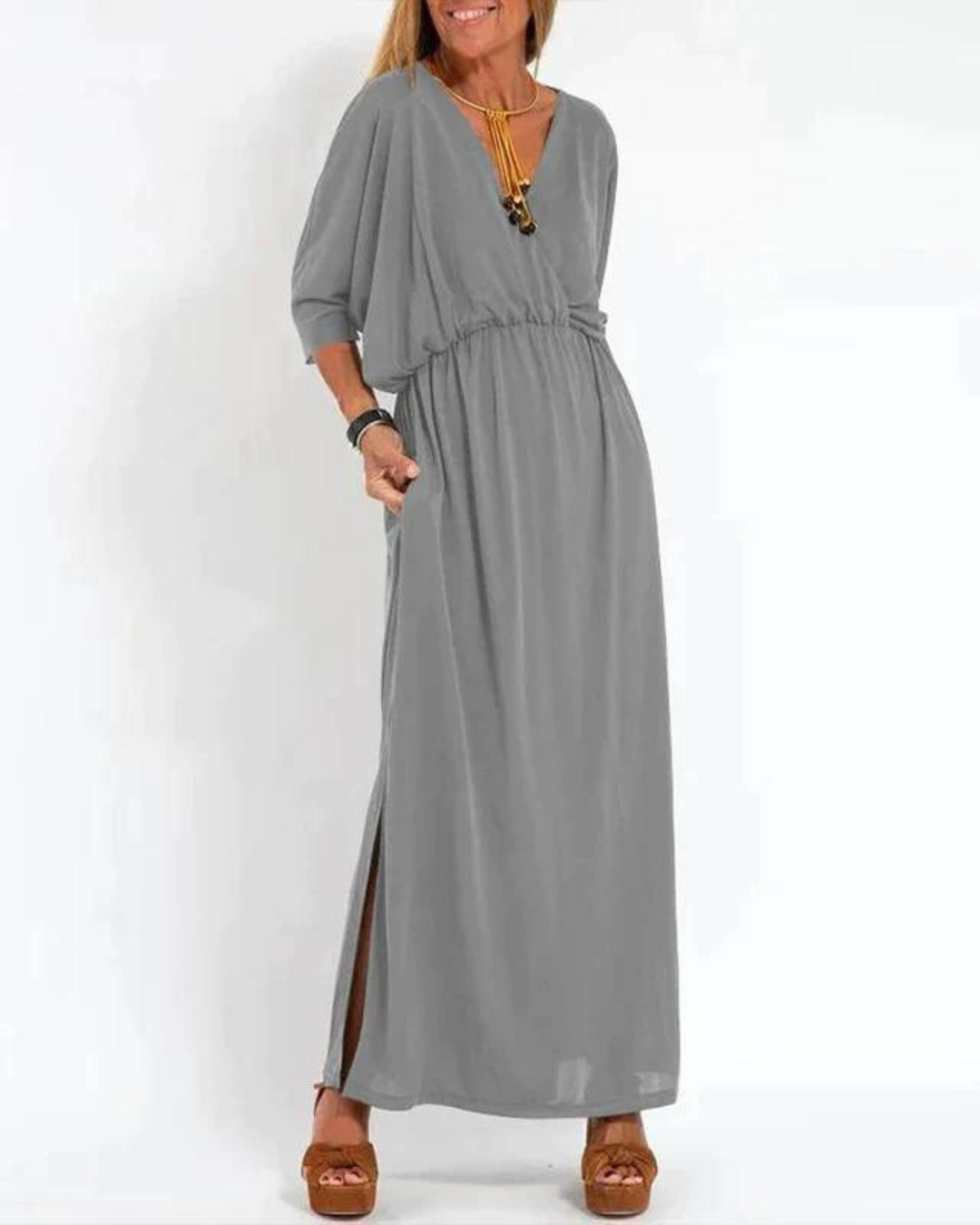 Versatile women's adjustable strap flowy long dress, perfect as a beach dress, day dress, or casual elegant attire.