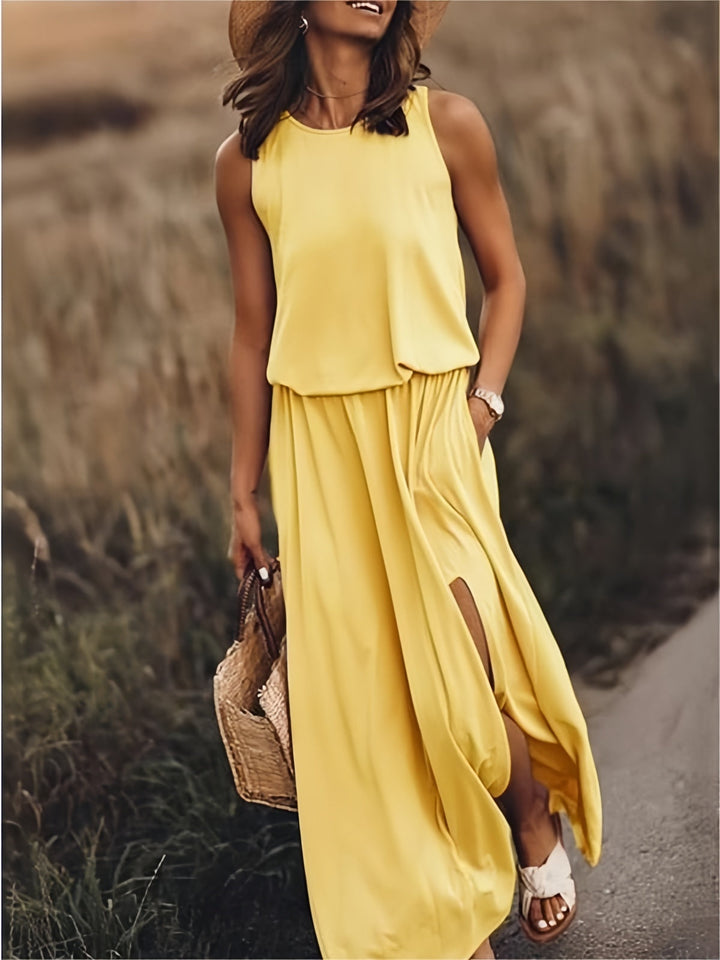Women's flowy maxi dress with elastic waist, side slit pockets, perfect for summer casual wear.