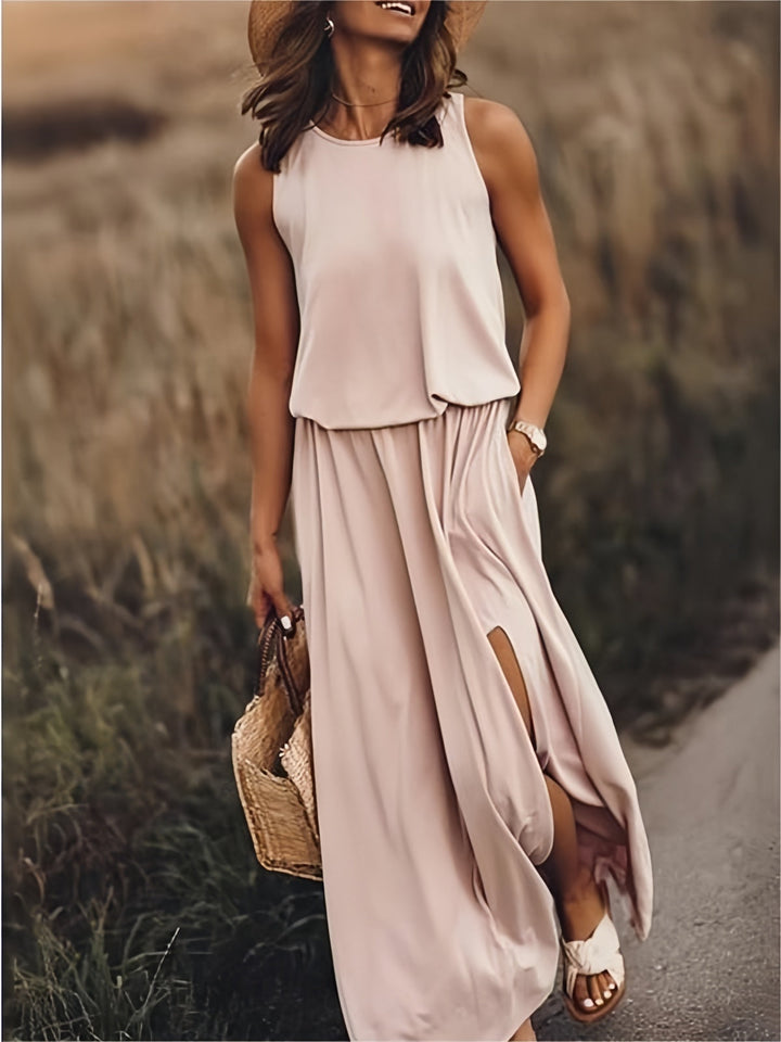 Casual women's summer maxi dress with elastic waist and convenient side slit pockets.