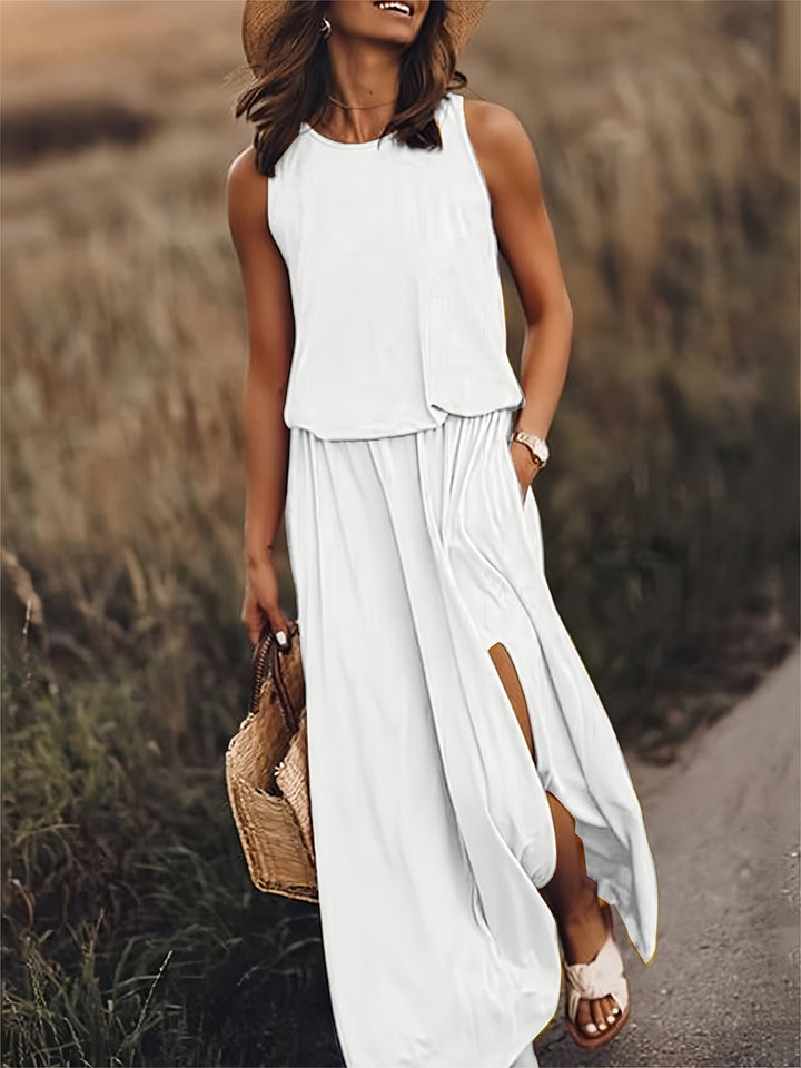 Sleeveless women's maxi dress with a comfortable elastic waist & stylish side slit pockets.