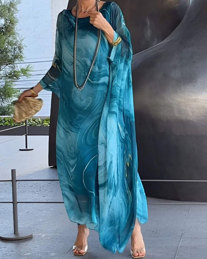 Women's flowy midi dress with tummy coverage, perfect for casual summer wear. Comfortable & versatile.