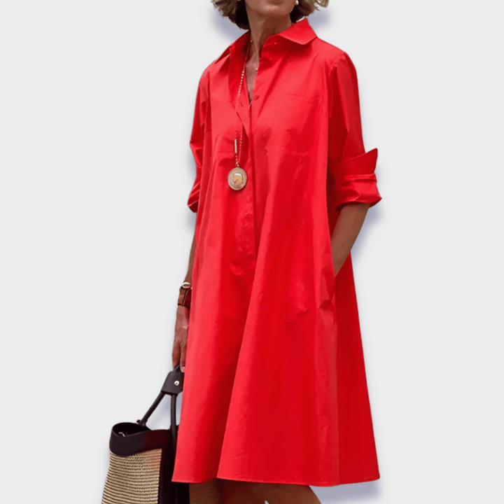 Women's flowy midi shirt dress with functional buttons and side pockets, perfect for casual summer wear.