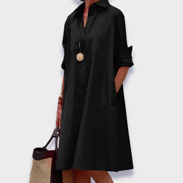 Stylish oversized button-up midi shirt dress for women, featuring a relaxed fit and practical pockets. Ideal for vacation.