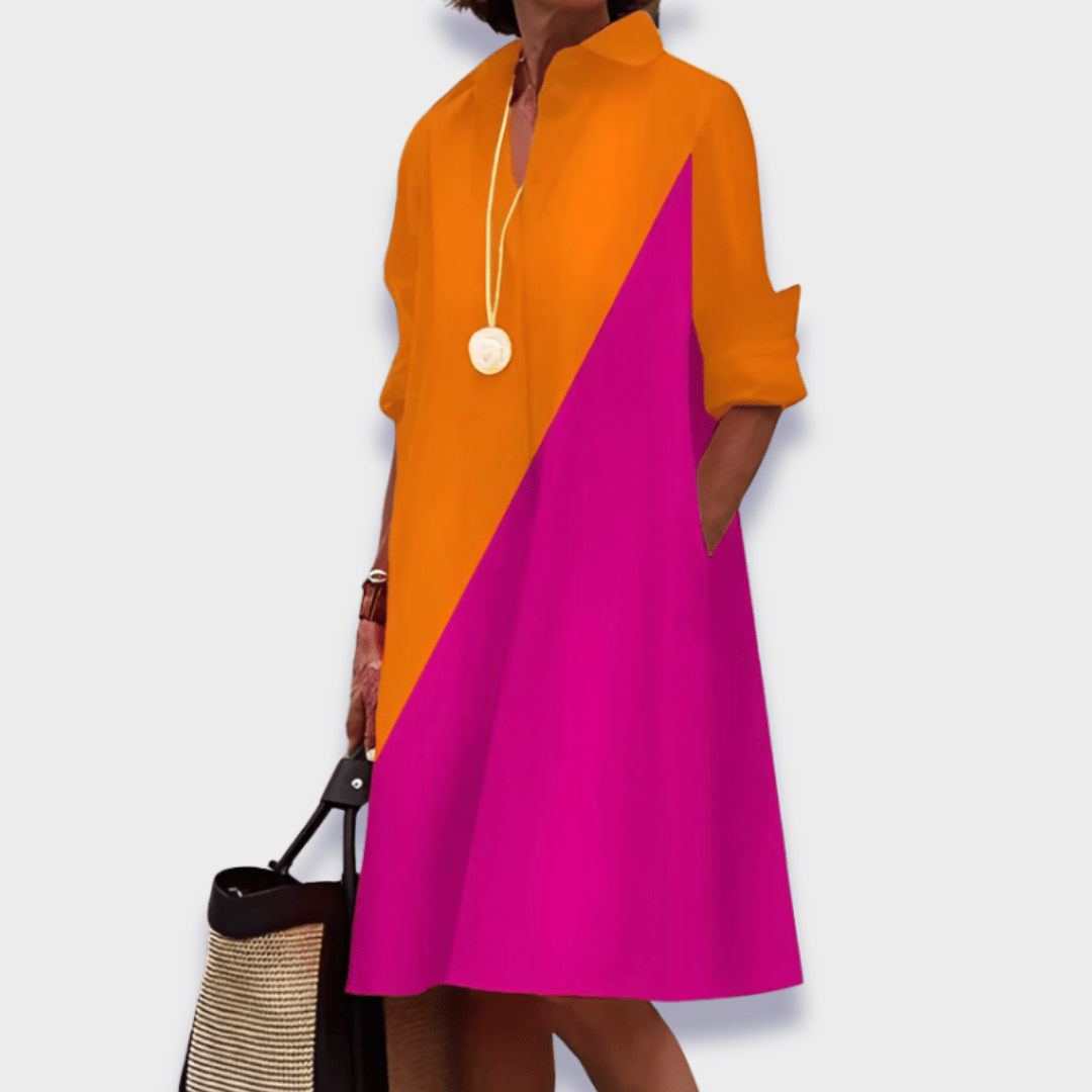 Versatile women's everyday midi shirt dress. Flowy silhouette, full button closure, and convenient side pockets.