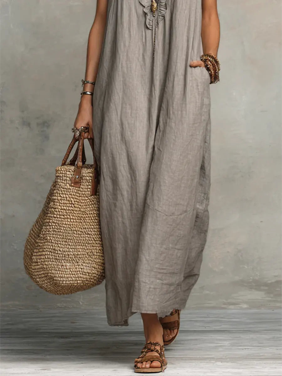 Relaxed fit women's flowy maxi dress, V-neck, flutter sleeves, ideal for beach or casual wear.