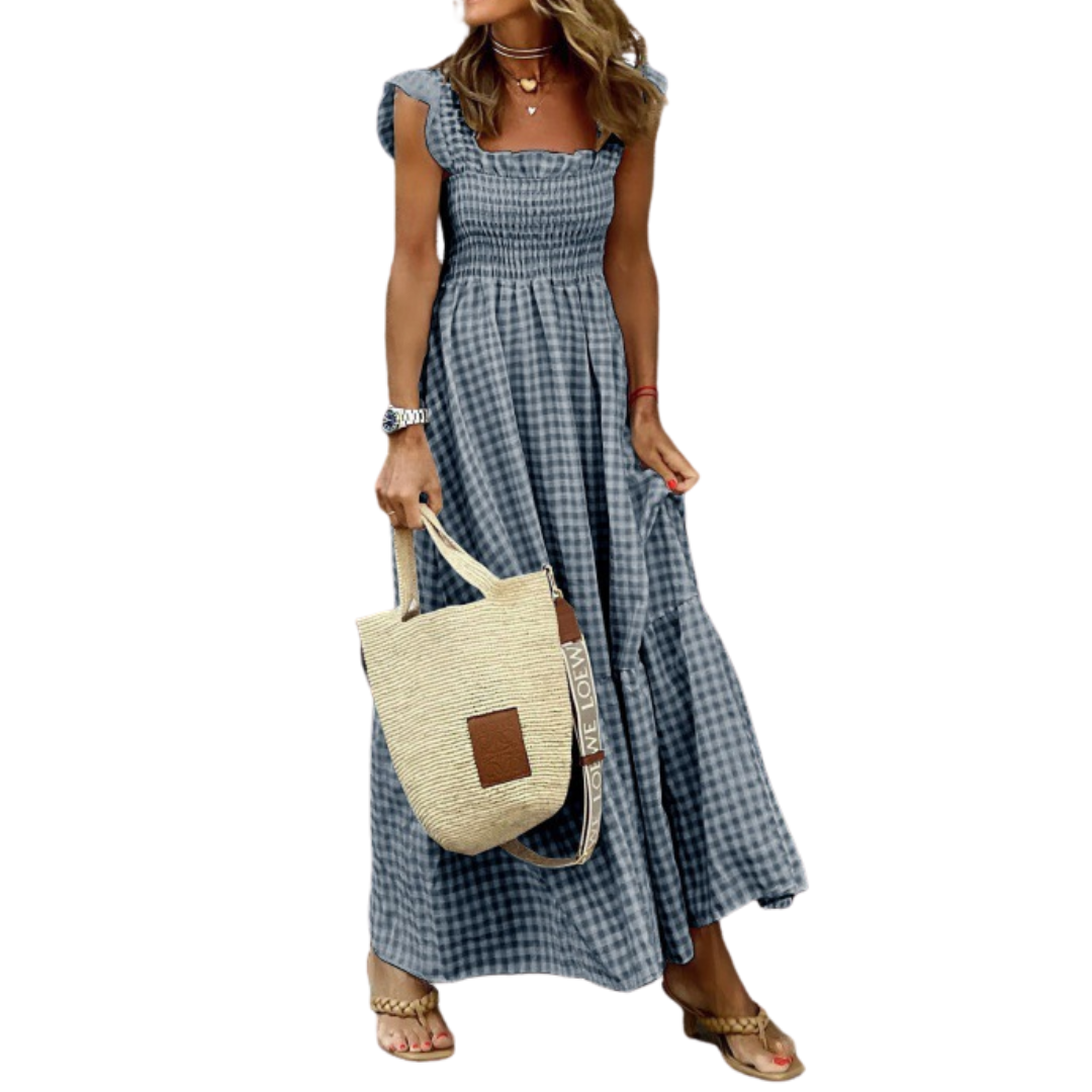 Elegant smocked tiered maxi dress in dark gray, perfect for casual outings or spring vacation wear.