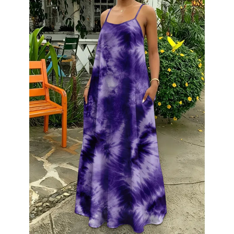 Vibrant tie-dye maxi dress with thin straps, a versatile women's summer dress for casual or vacation outfits.