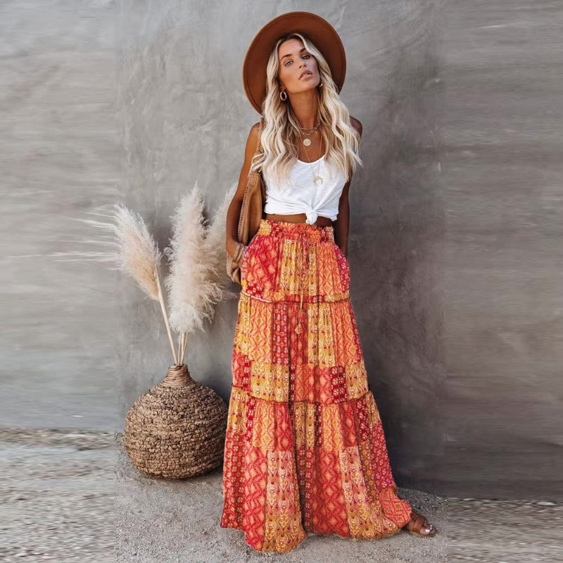 Women's flowy tiered floral maxi skirt, high waist, perfect for summer bohemian style.