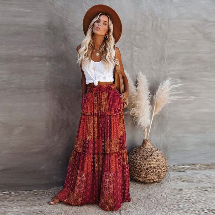 A-line tiered floral maxi skirt with elastic high waist, ideal for beach vacations.