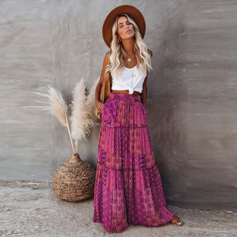 Model in comfortable flowy tiered floral maxi skirt, high waist, showcasing a casual summer look.