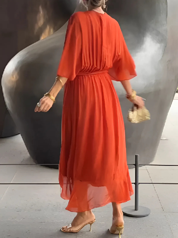 Back view of an elegant women's flowy V-neck belted maxi dress, a long summer fashion statement.