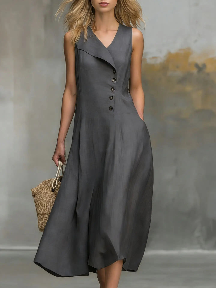 Sleeveless v-neck midi dress featuring elegant button detailing. Relaxed fit for women's casual style.