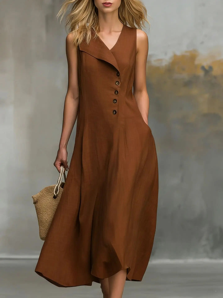 Comfortable women's sleeveless v-neck flowy midi dress with decorative button details. Great for warm weather.