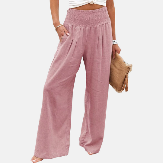 Women's flowy wide leg summer pants in motion, showcasing soft fabric, relaxed fit, and elastic waist comfort.