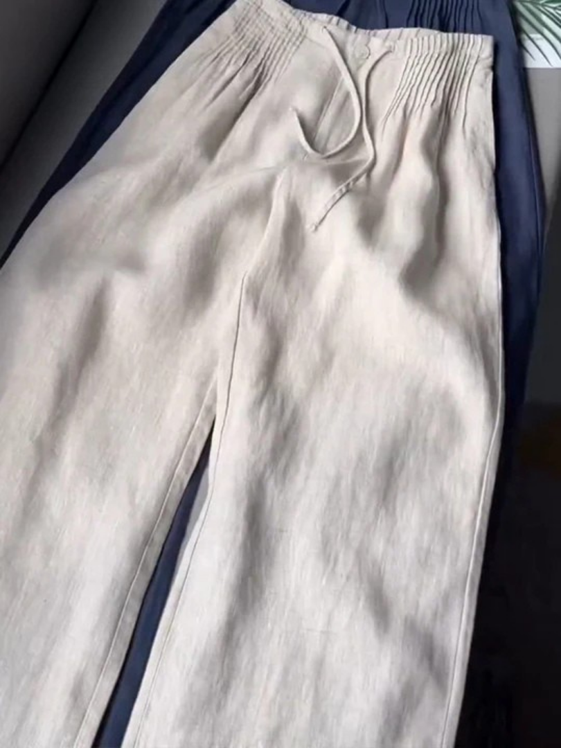 Chic wide-leg women's trousers with an elastic waist, great for stylish everyday summer fashion.