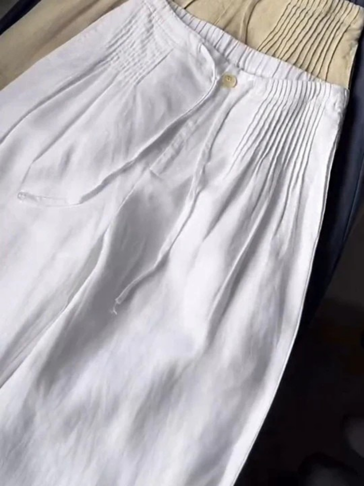 Lightweight flowy wide-leg women's trousers, designed for a relaxed yet stylish look.