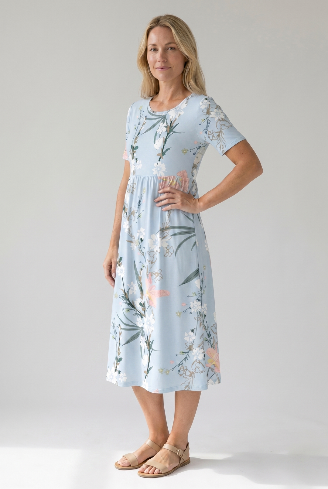 Round neck, short sleeve, floral print A-line midi dress for women, offering a fresh, comfortable summer look.