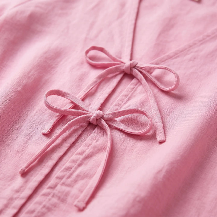 Stylish women's summer blouse with adjustable tie front. Offers a relaxed, breezy fit for everyday wear.