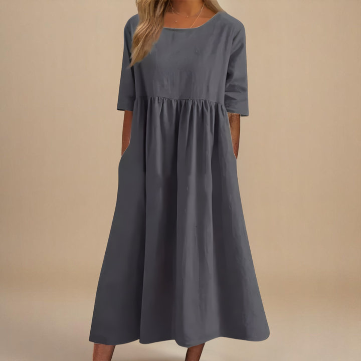 Comfortable women's flowy midi dress, half-sleeve with gathered waist, ideal for everyday style.
