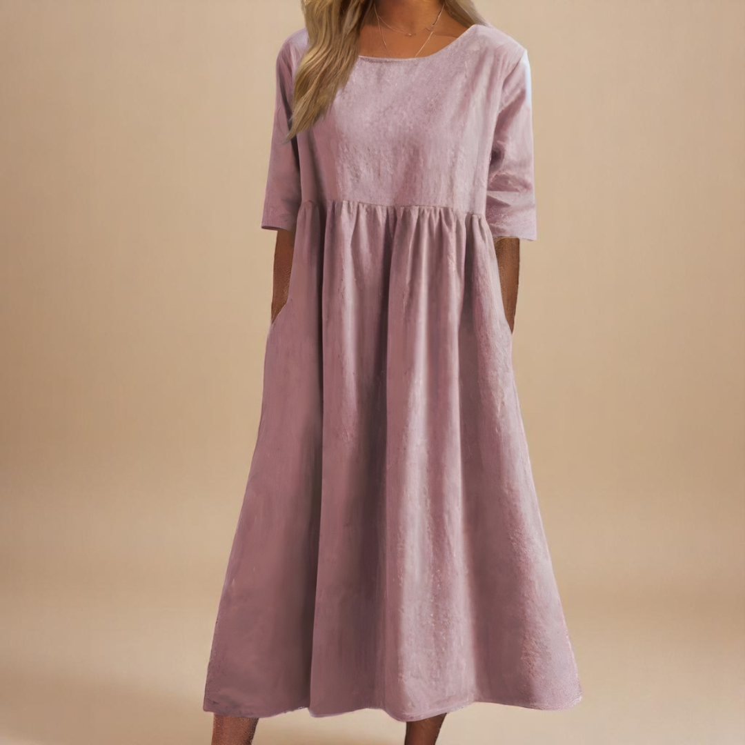 Relaxed fit women's midi dress, half-sleeve, with a gathered waist and practical pockets for casual wear.