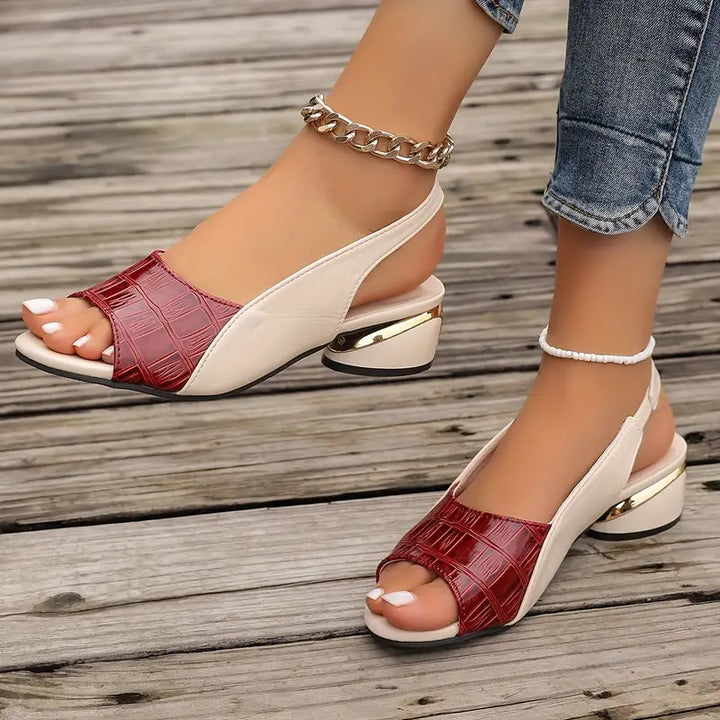 Chic women's open-toe leather sandals with a supportive cushioned footbed, ideal for versatile everyday wear.