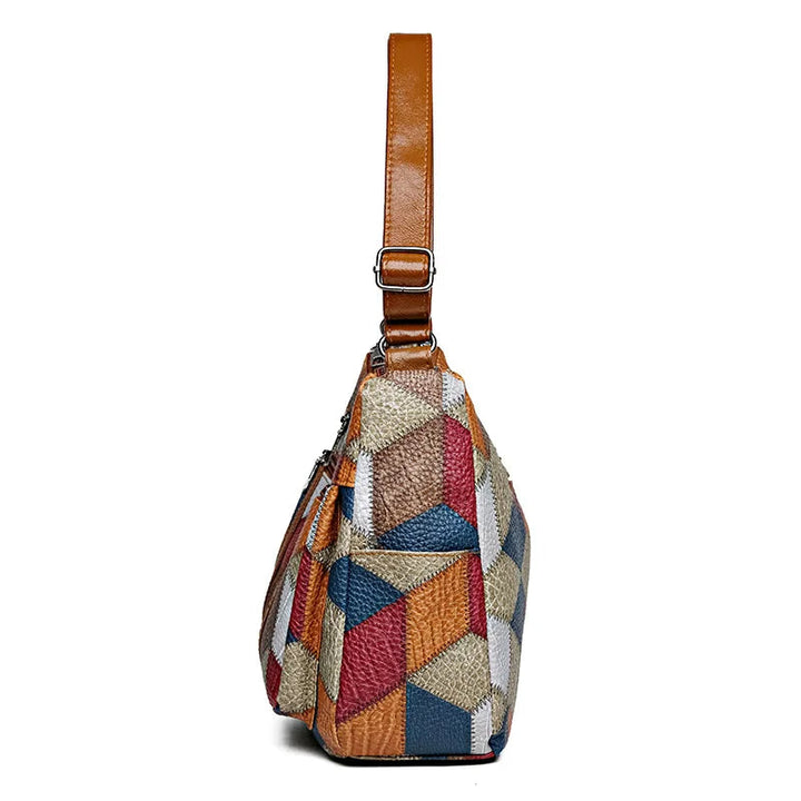 Eco-conscious women's geometric patchwork vegan leather handbag, a stylish and ethical choice.