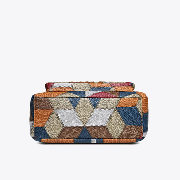 Detailed view of the geometric patterns on a women's vegan leather patchwork shoulder bag.