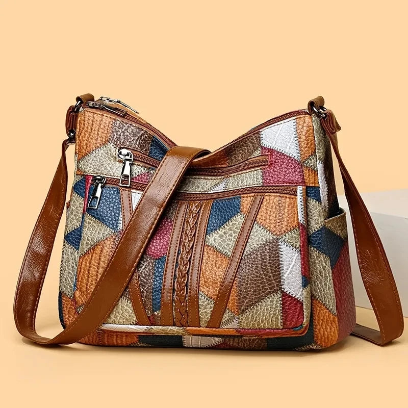 Stylish geometric patchwork vegan leather shoulder bag for women, a modern fashion accessory.