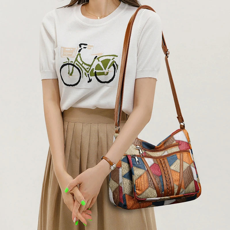 Spacious geometric patchwork vegan leather shoulder bag for women, holding all daily essentials.
