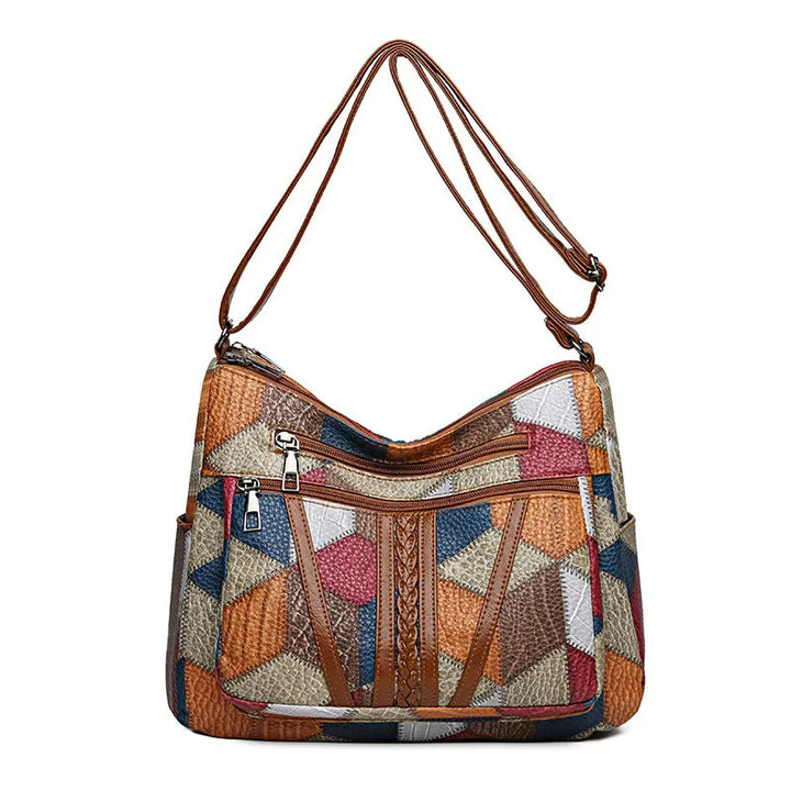 Make a statement with this geometric patchwork vegan leather handbag, a women's fashion accessory.