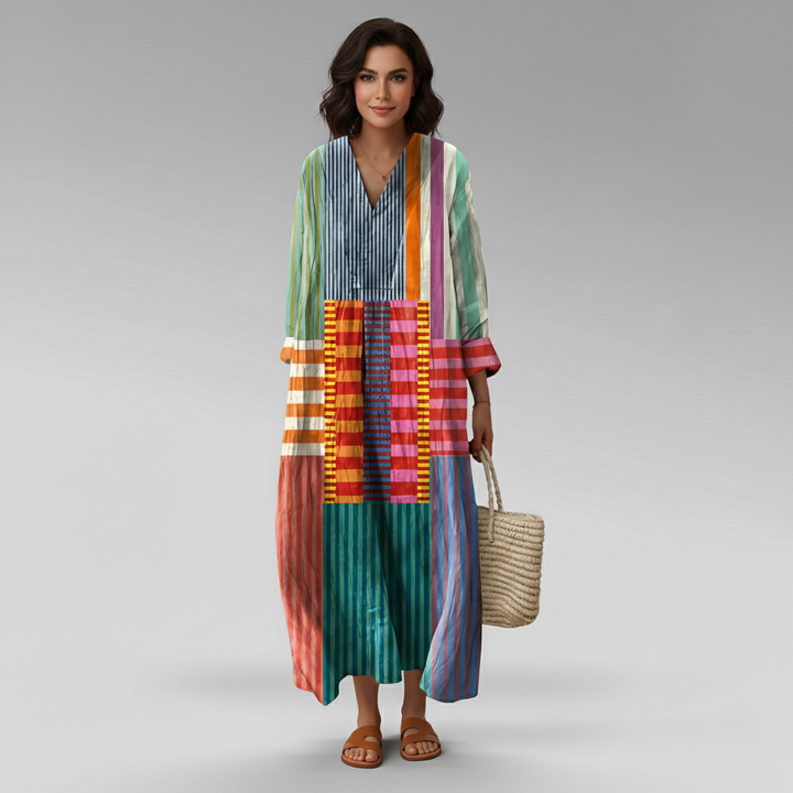 Relaxed fit women's long sleeve maxi caftan dress featuring a unique geometric print and stylish v-neck.
