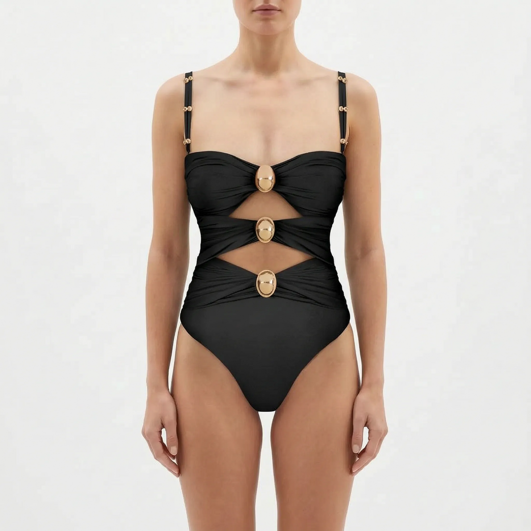 Elegant women's monokini one-piece with cutout details and a starfish motif.