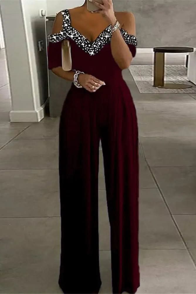 Women's glamorous rhinestone jumpsuit, perfect for elegant parties & special occasions. Sparkling one-piece evening wear.