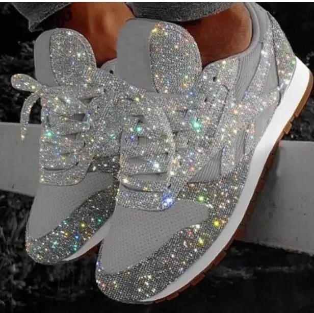 Black glitter lace-up women's sneakers. Stylish and comfortable everyday fashion footwear.