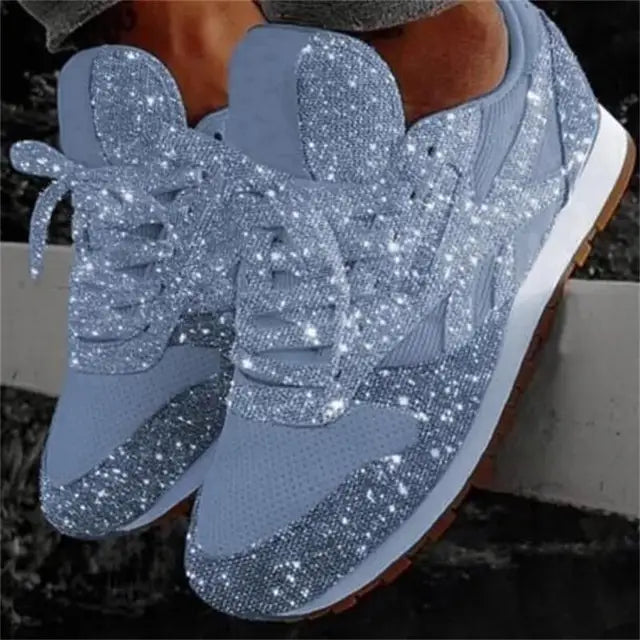 Pink sparkling lace-up sneakers for women. Comfortable everyday shoes with a fashionable glitter finish.