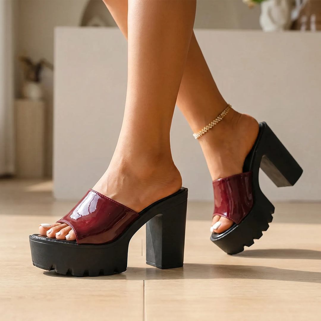 Women's glossy black platform sandals with chunky block heels, perfect for parties & evening wear.