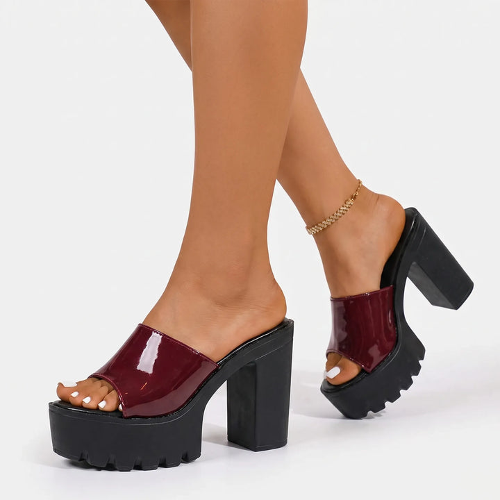 Stylish slip-on platform sandals for women, featuring a glossy finish and comfortable block heel.