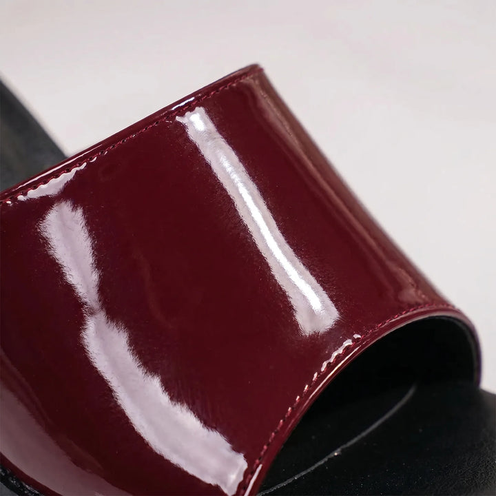 Open-toe tall glossy platform sandals with a chunky block heel for women's party footwear.