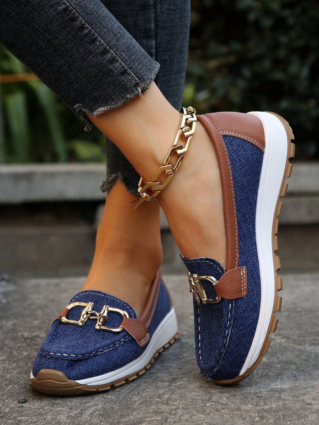 Women's gold buckle flats. Comfortable and stylish slip-on loafers, perfect for adding elegance to any outfit.