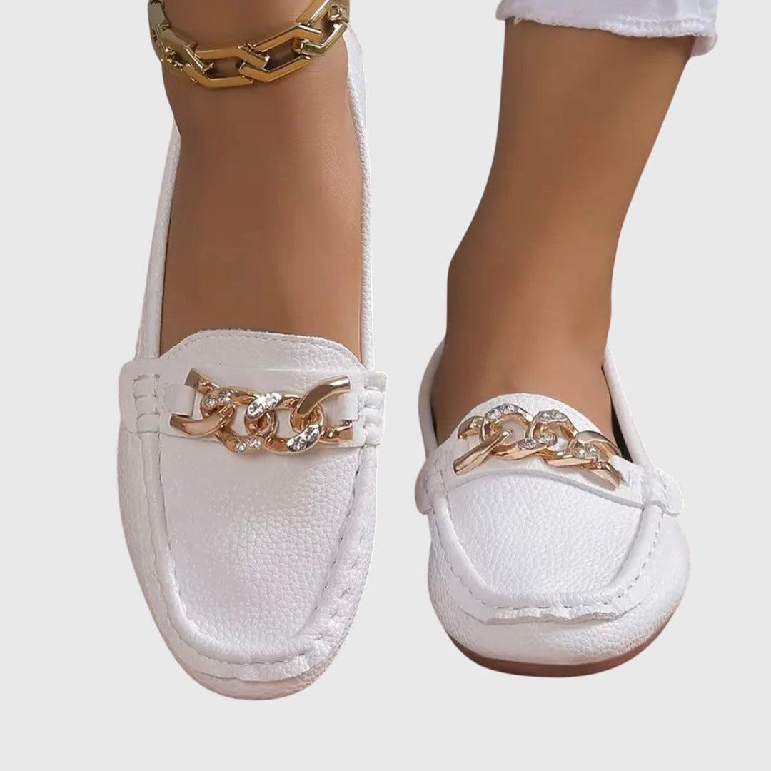 Modern women's gold-chain wedge loafers with a comfortable heel.