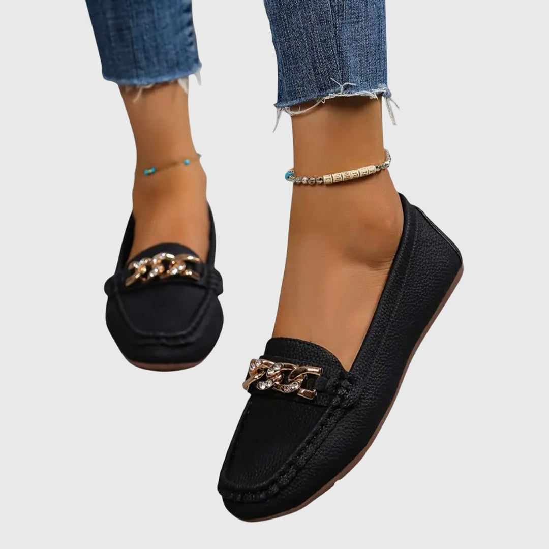 Stylish women's wedge loafers with chic gold chain detail.