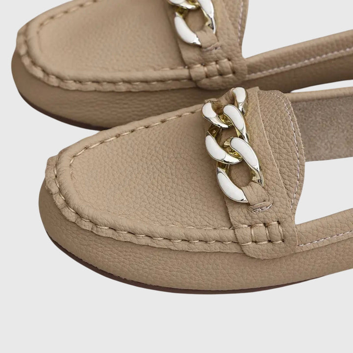 Versatile women's gold-chain wedge loafers for casual or dressy looks.