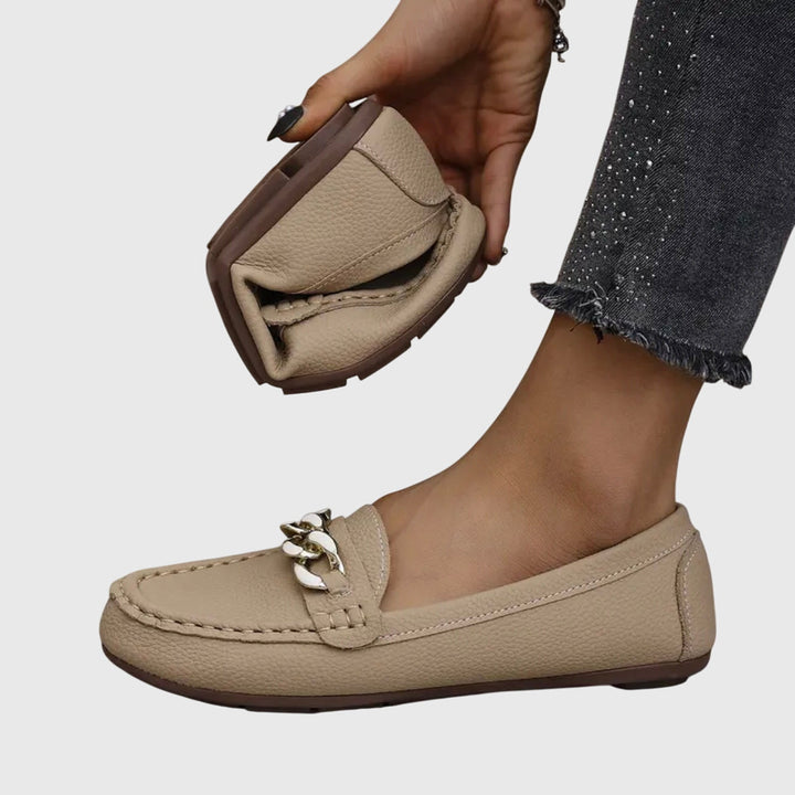 Stylish women's footwear: gold-chain wedge loafers, comfortable & chic.