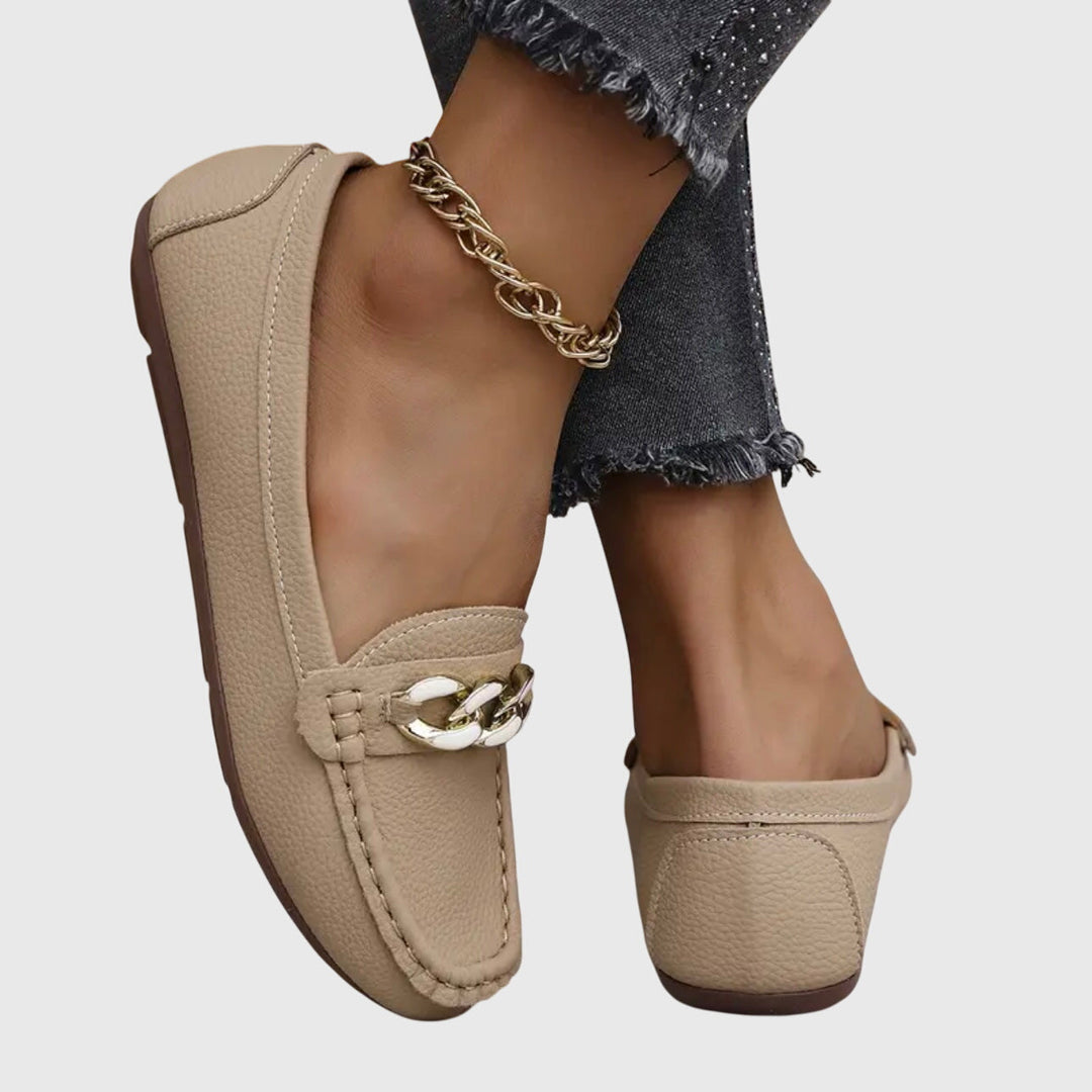 Women's elegant gold-chain wedge loafers, ideal for office or evening.
