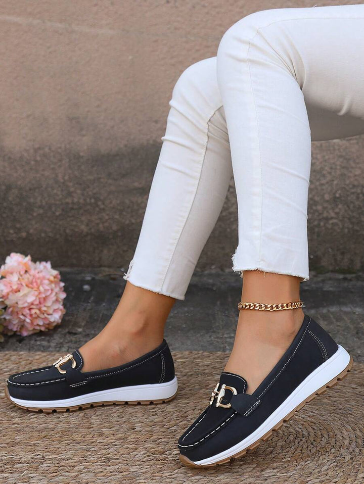 Grey women's horsebit loafers with stylish gold detail. Comfortable slip-on shoes for office & casual wear.