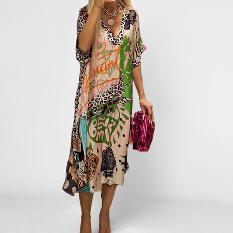 Colorful women's short sleeve V-neck swing tunic dress with a unique graphic print. Ideal for summer vacation & spring.
