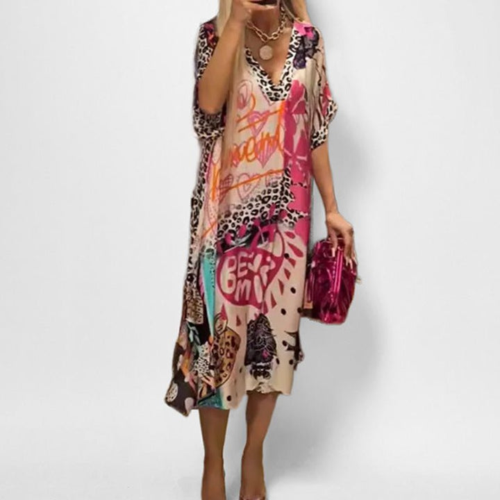 Casual women's graphic print V-neck tunic dress in a comfortable swing fit. Great short sleeve style for spring & summer.