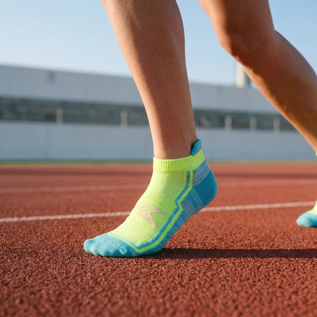 Women's green non-slip ankle athletic socks for running and workouts. Moisture-wicking performance sport socks.